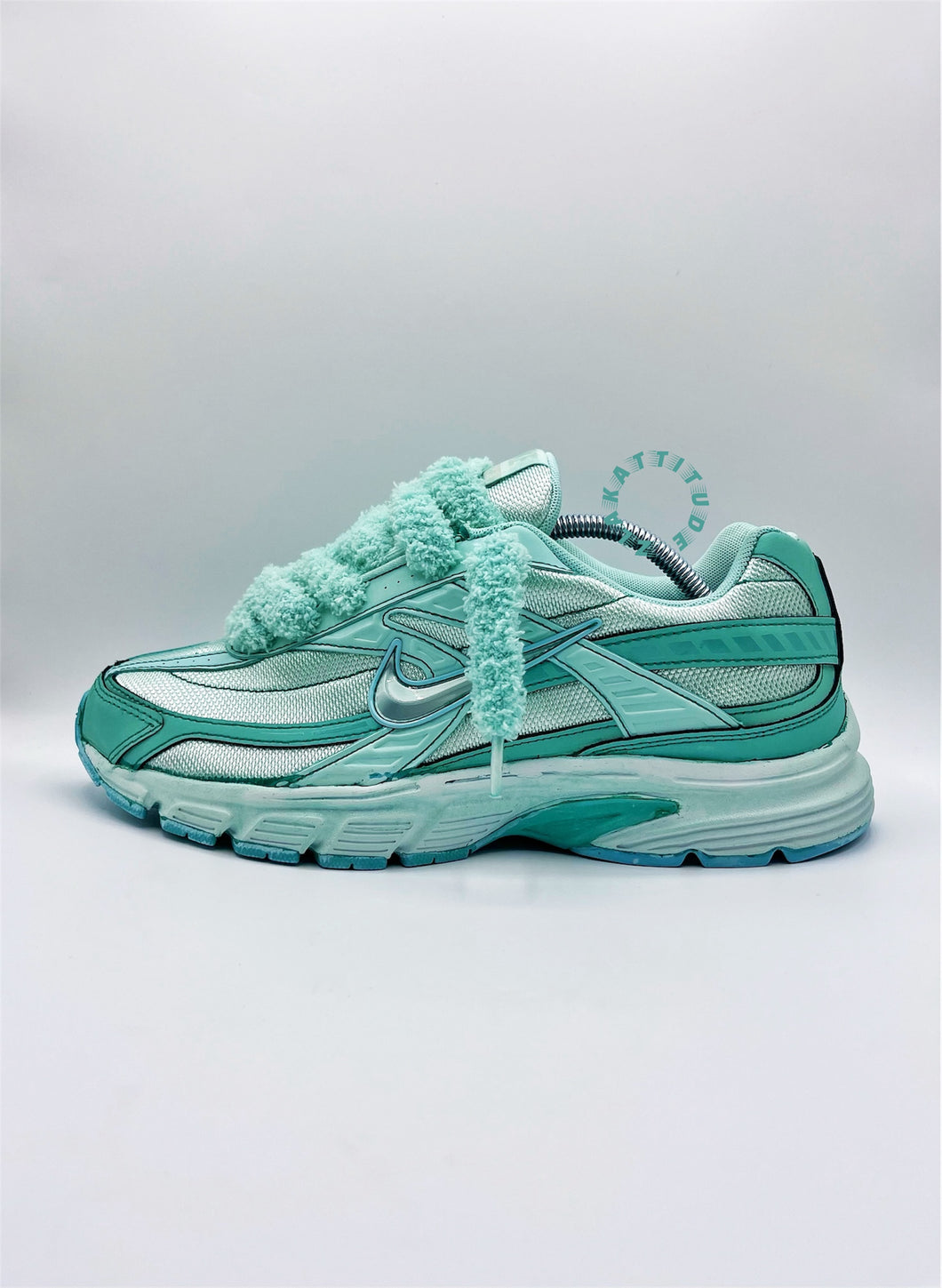 GREEN NIKE TOUDOUX